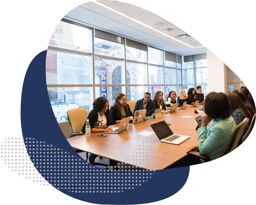 Professionals in a modern conference room engaged in a meeting.